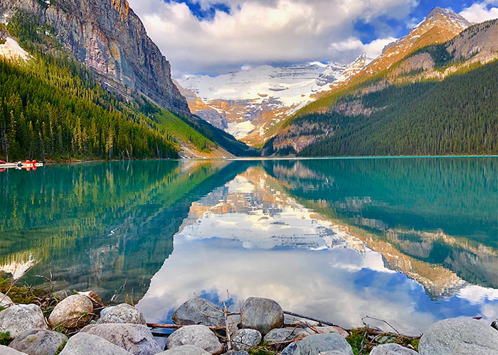 Reflection of mountains on perfectly still day in spring