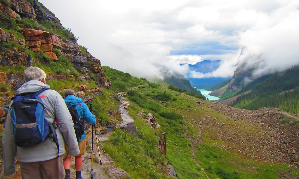 hikers on the plain of Six Glaciers Hike
