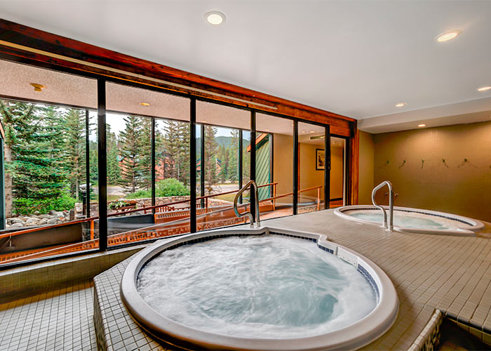 2 whirlpools with big windows looking out into nature