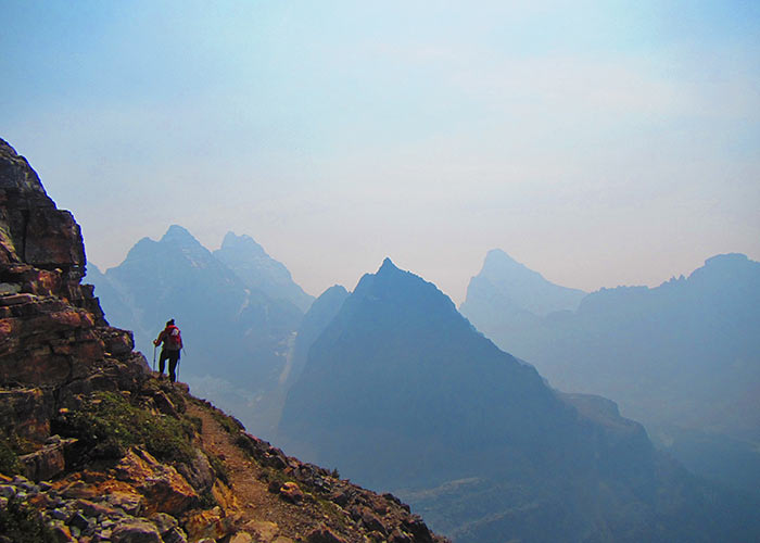 Hiker on steep moutain path