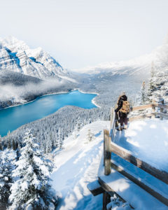 Women at lookout overlooking Peyto Lake on a winter day