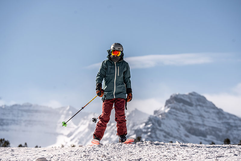 Skiier stands at the top of a run in Lake Louise Ski Resort in Alberta Canada